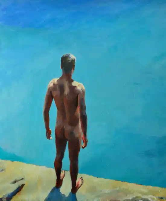 Male figure standing at the edge of an electric blue sea