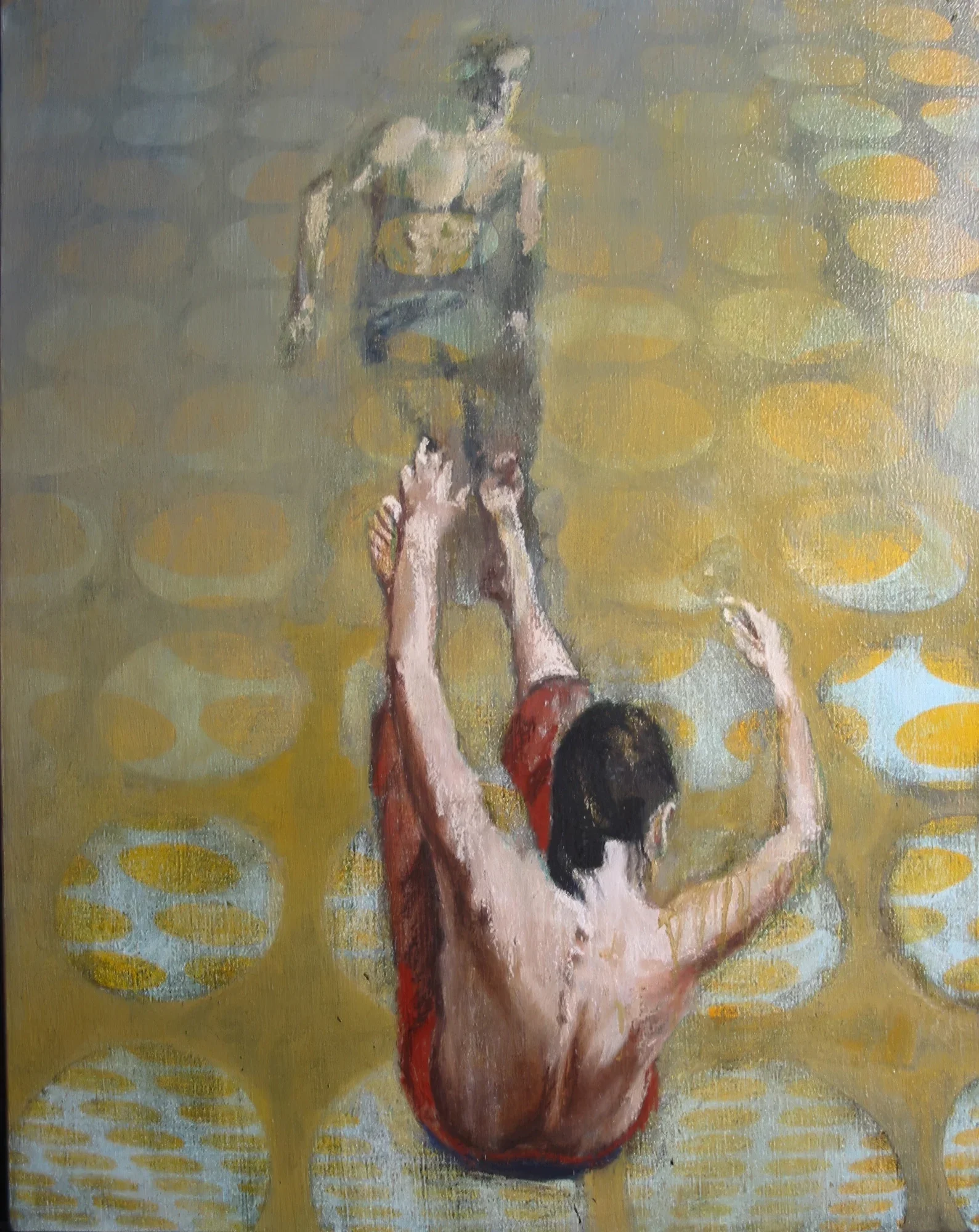 Two dancers moving against a geometric abstract background