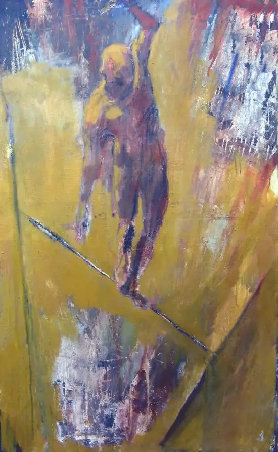 Tightrope walker balancing above an ochre fragmented canyon